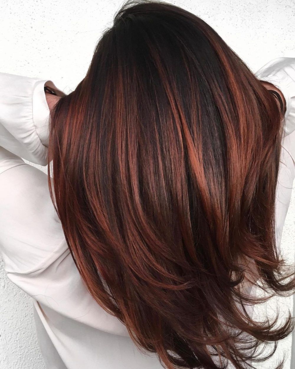 Auburn hair with blonde highlights for depth