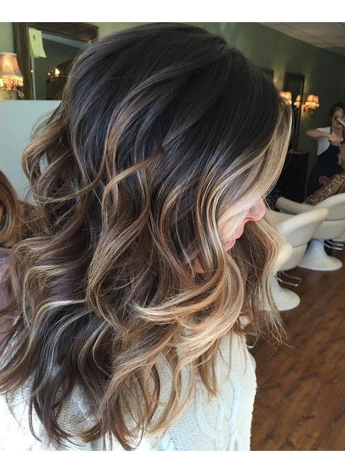 Soft curls with honey blonde highlights