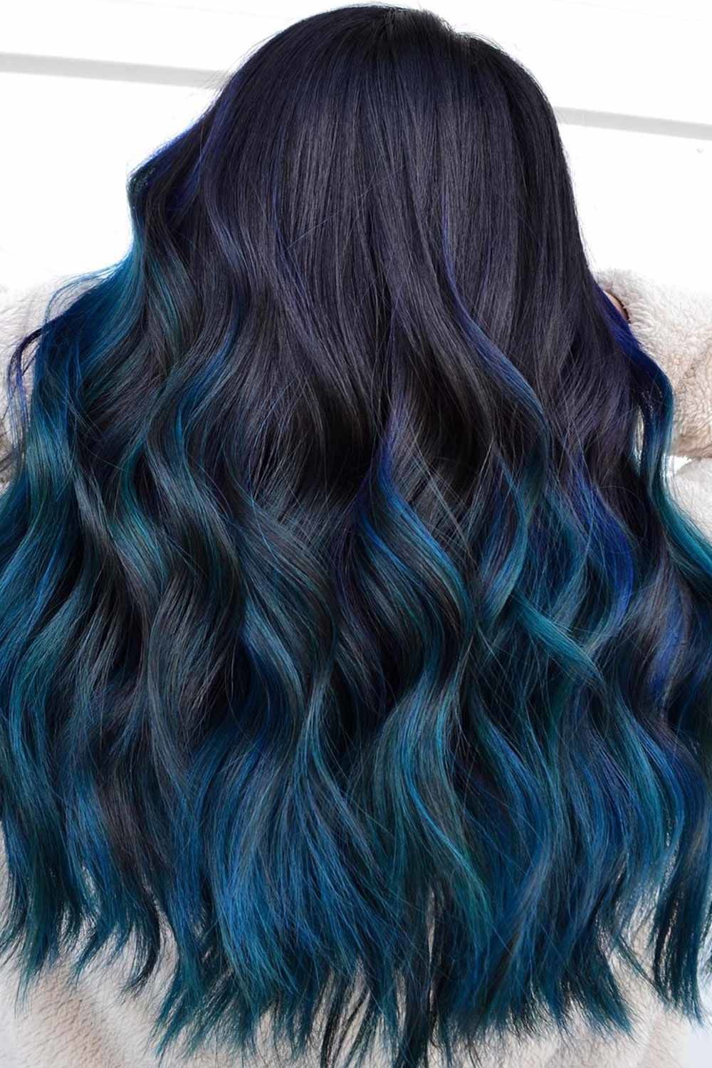 Dark blue balayage on black hair with waves