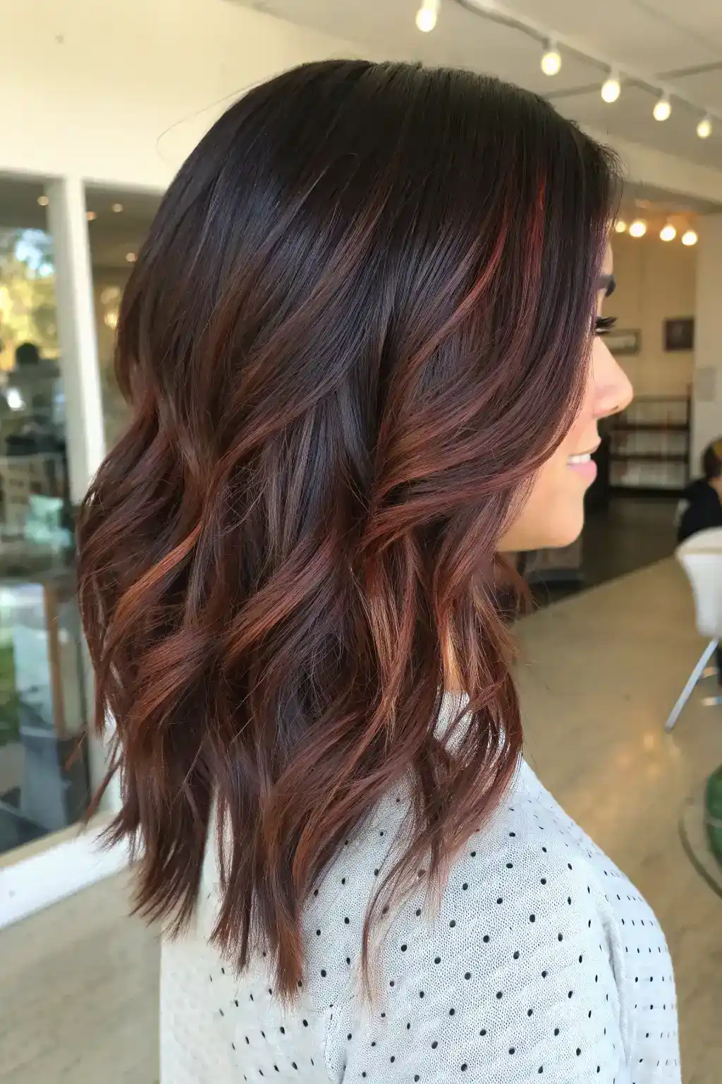 Auburn balayage on brunette hair with layers