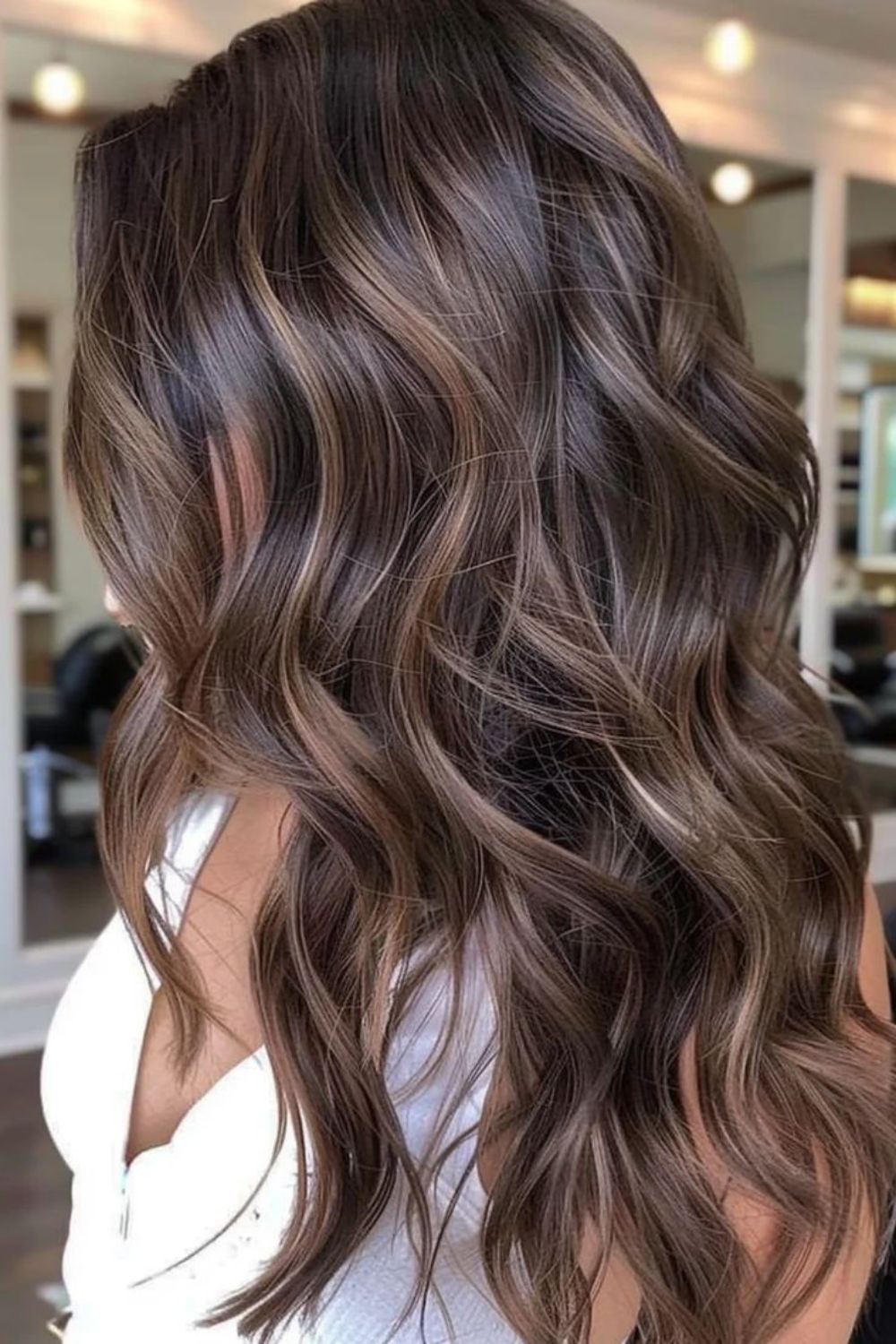 Rich brunette curls with balayage highlights