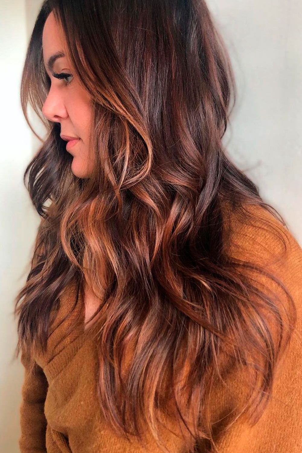 Long chocolate cherry hair with soft layers