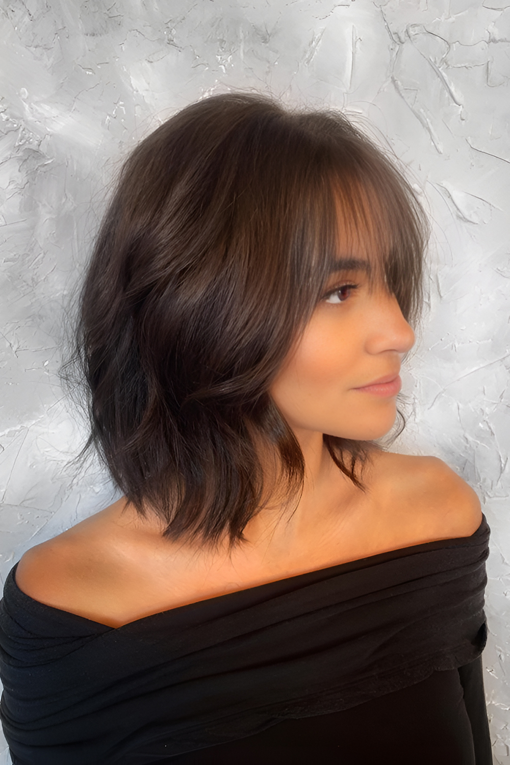 Soft wavy choppy bob with subtle bangs