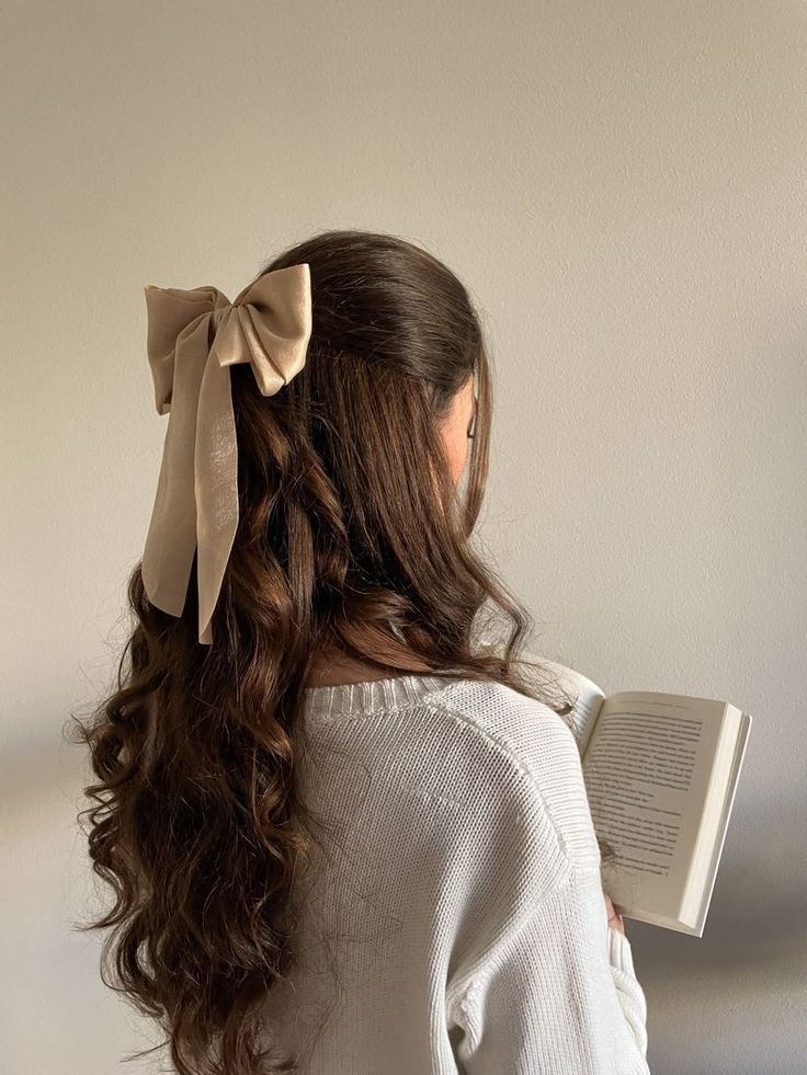 Soft curls with satin bow, romantic spring hairstyle