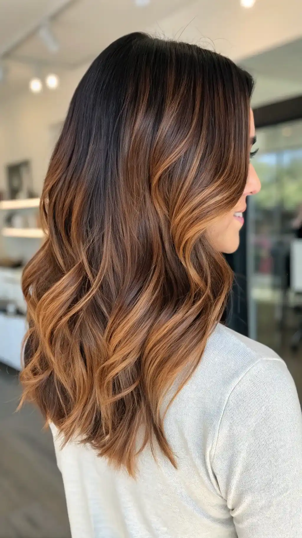 Long wavy hair with copper highlights