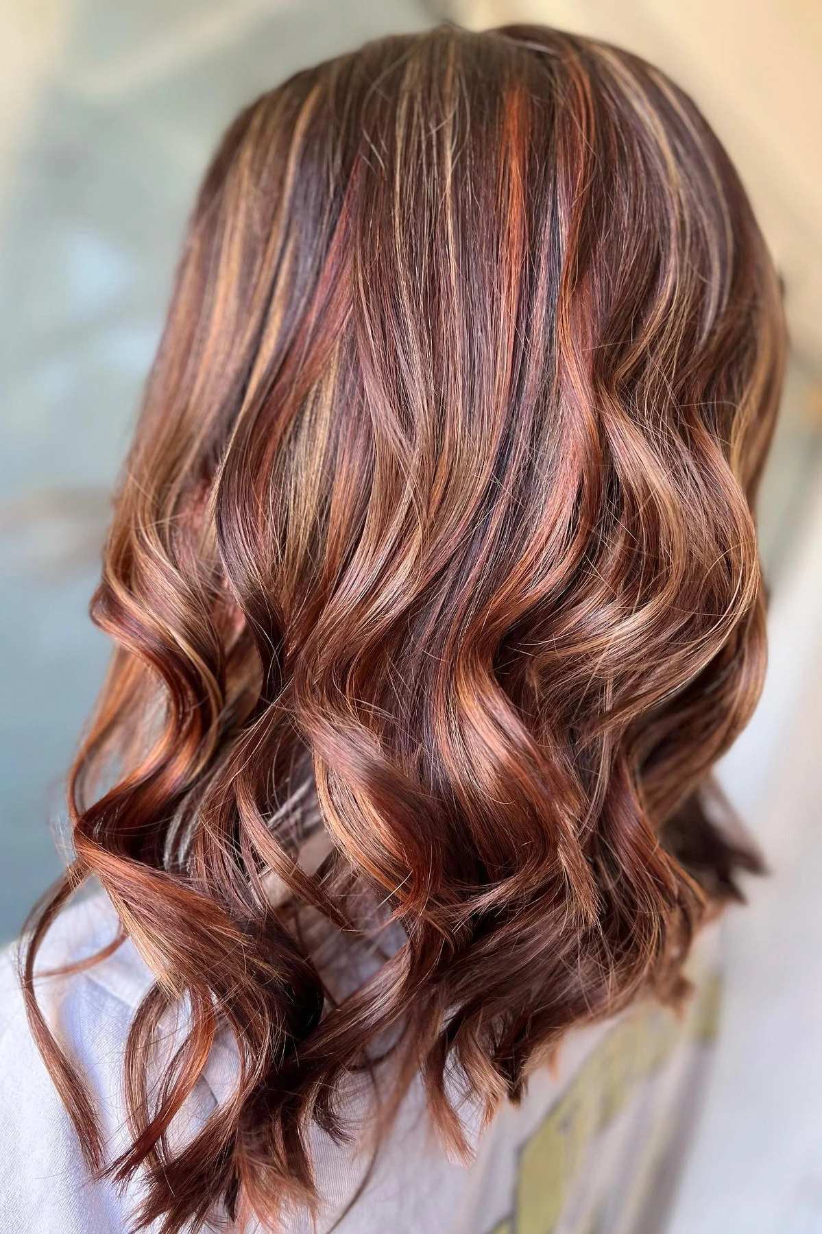 Medium curls with copper highlights