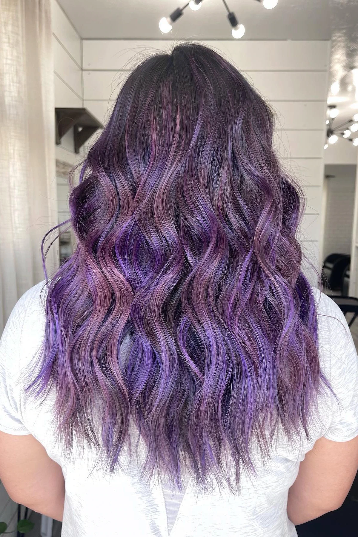 Medium wavy hair with violet highlights