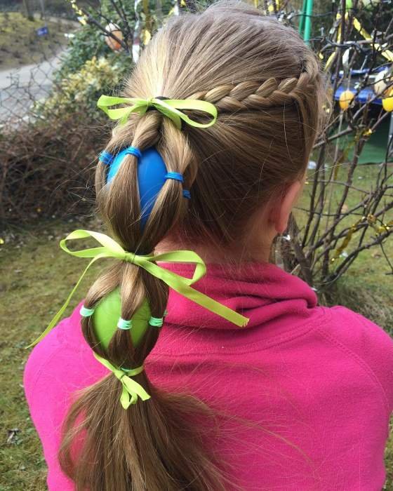 Creative braid with Easter egg decorations, perfect for a festive and fun look.