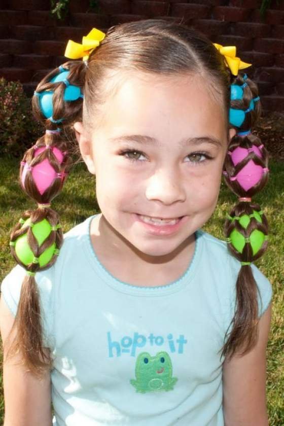 Bright pigtail hairstyle with Easter egg decorations for a festive and fun look