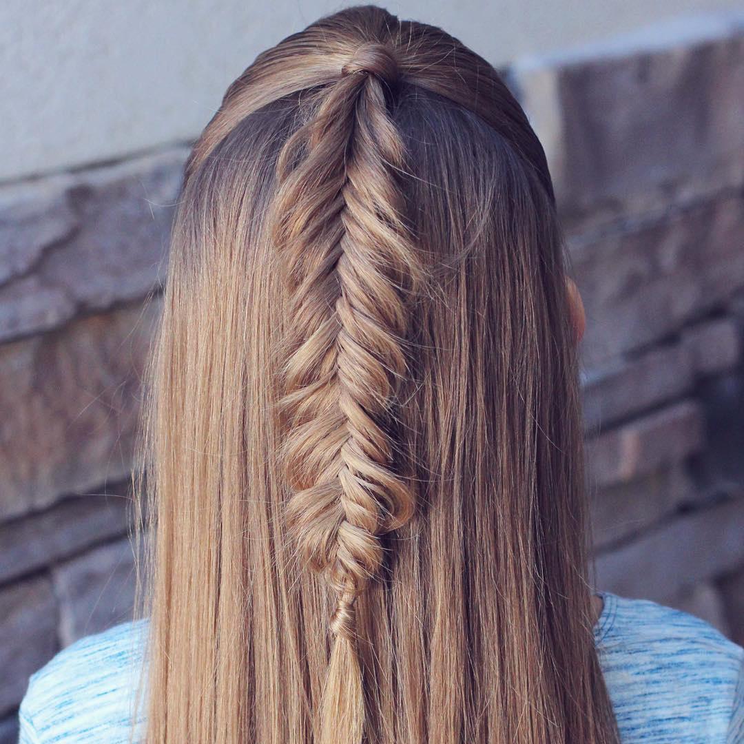 Elegant fishtail braid half-up hairstyle for a sophisticated Easter look