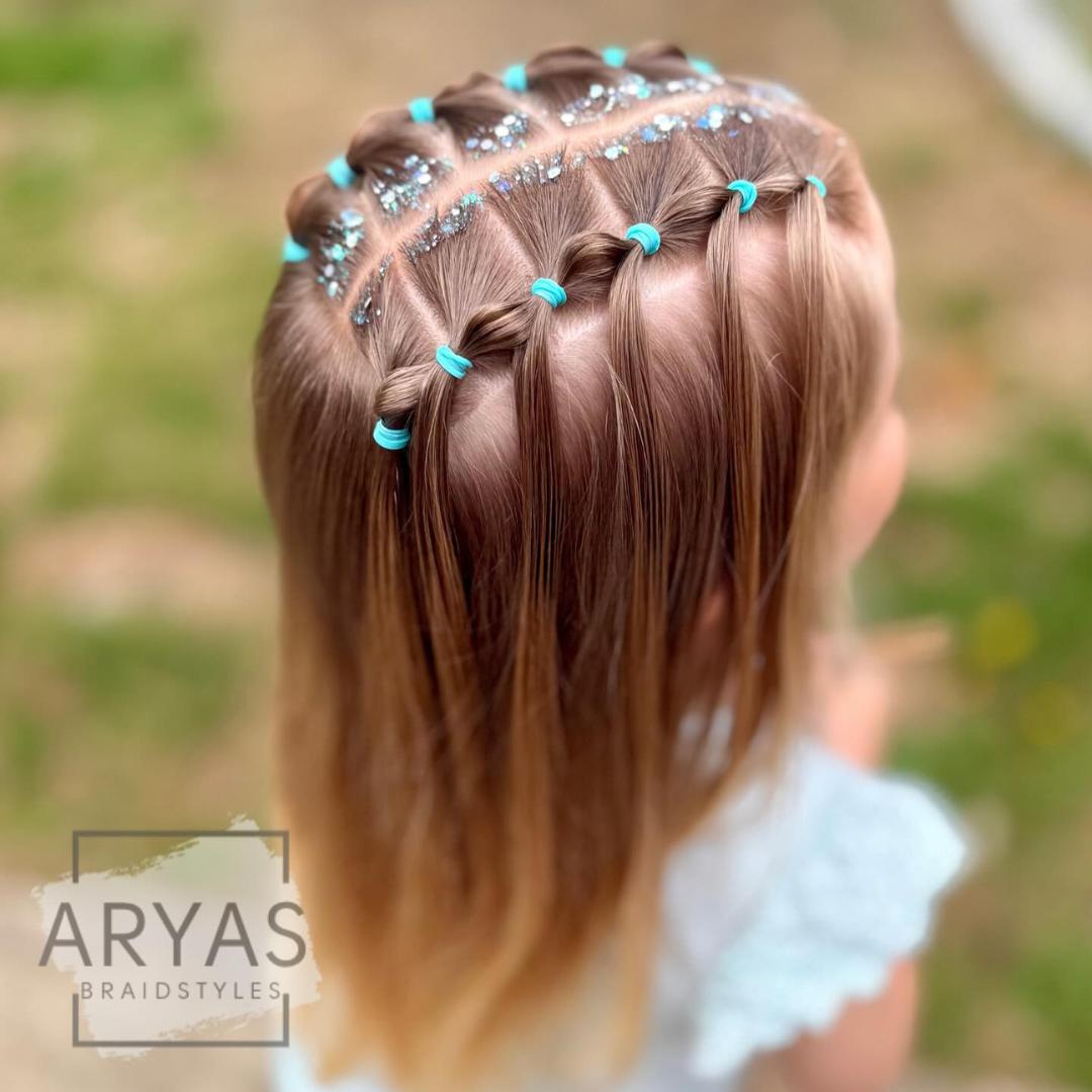 Sparkling star braid hairstyle with blue accents for a magical Easter look