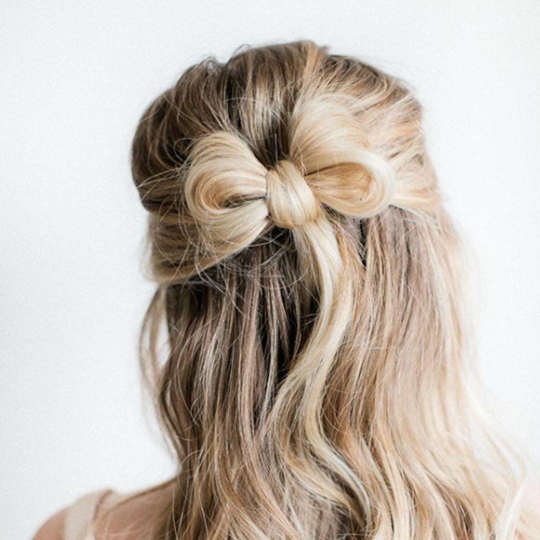 Chic half-up hairstyle with a bow, perfect for an elegant Easter look