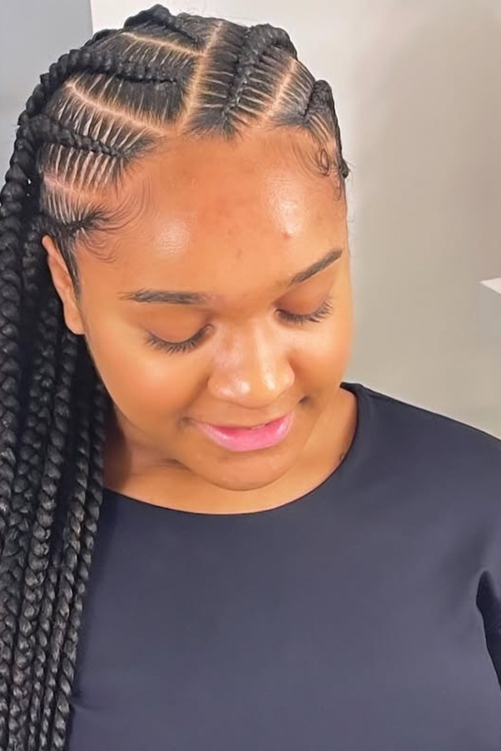 Elegant side-swept Fulani braids with sleek finish