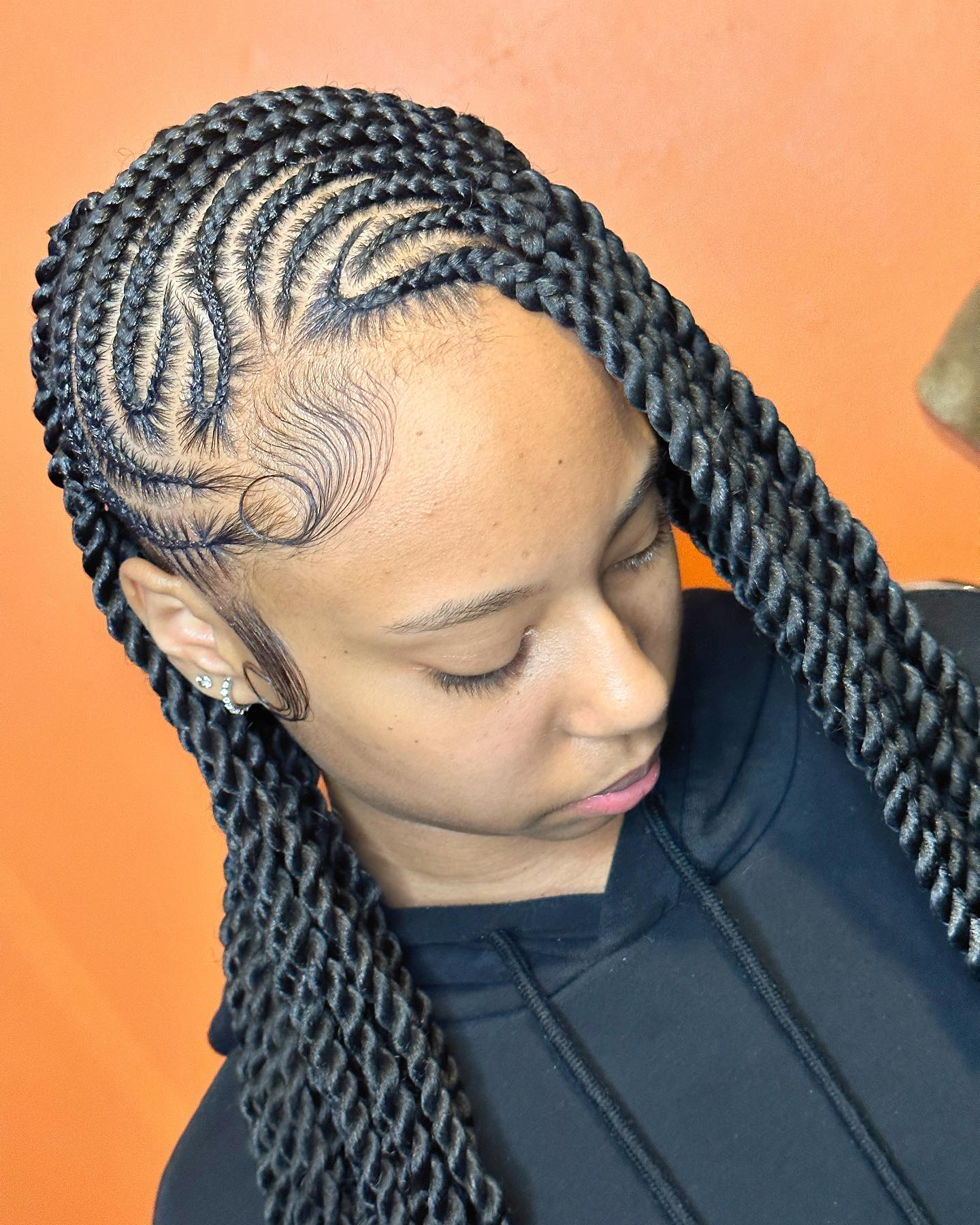 Textured Fulani braids with swirling patterns