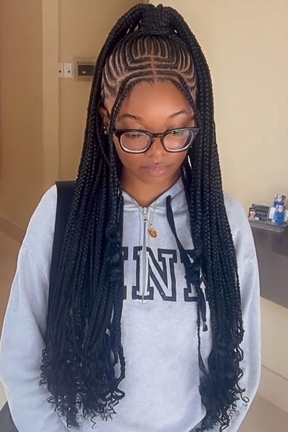 High ponytail Fulani braids with defined edges