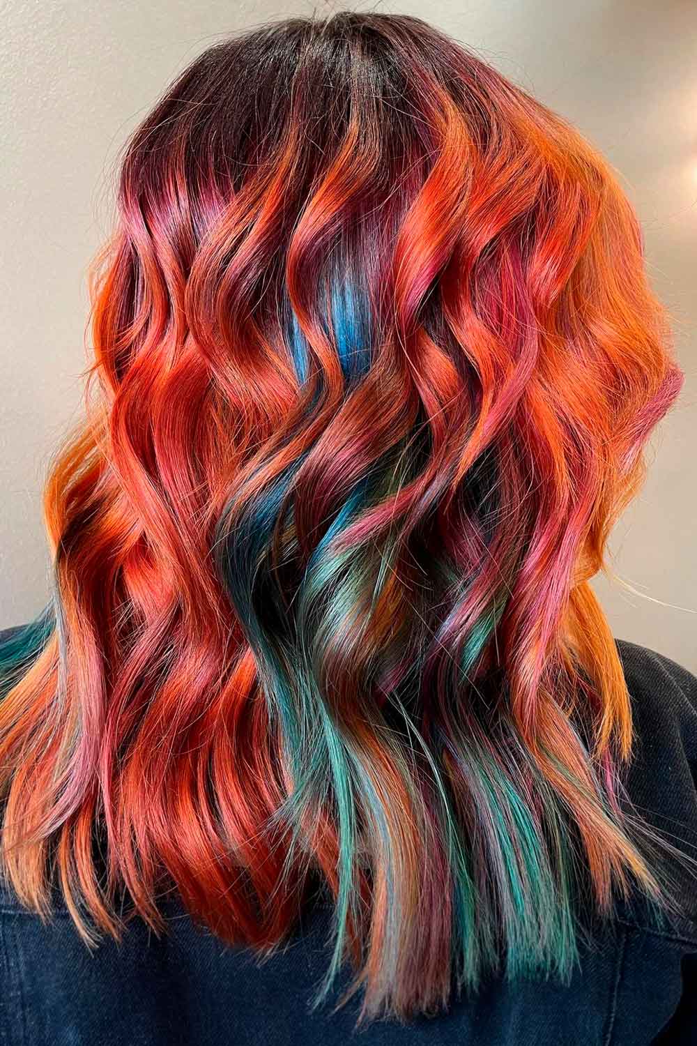 Vibrant red, orange, and teal curls