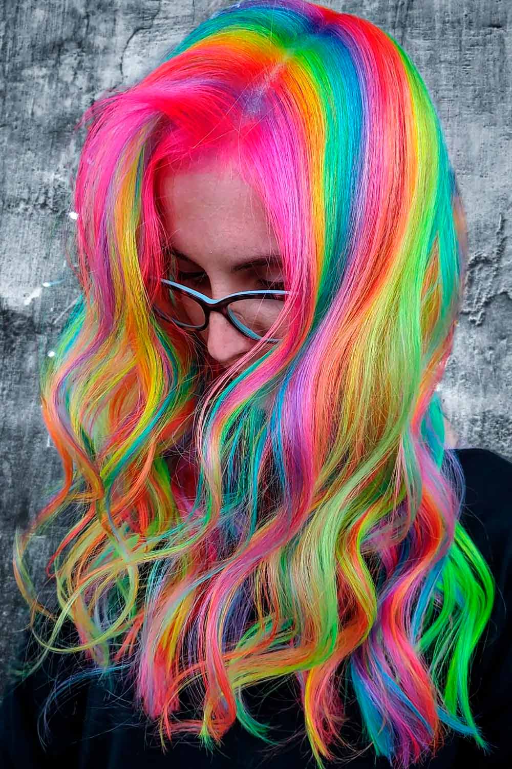 Bold rainbow curls with volume