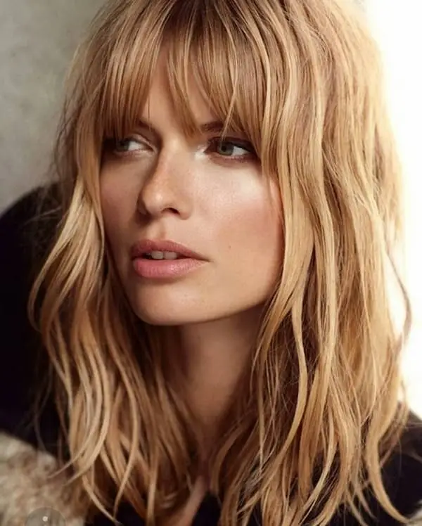 Textured lob, wispy bangs, airy style