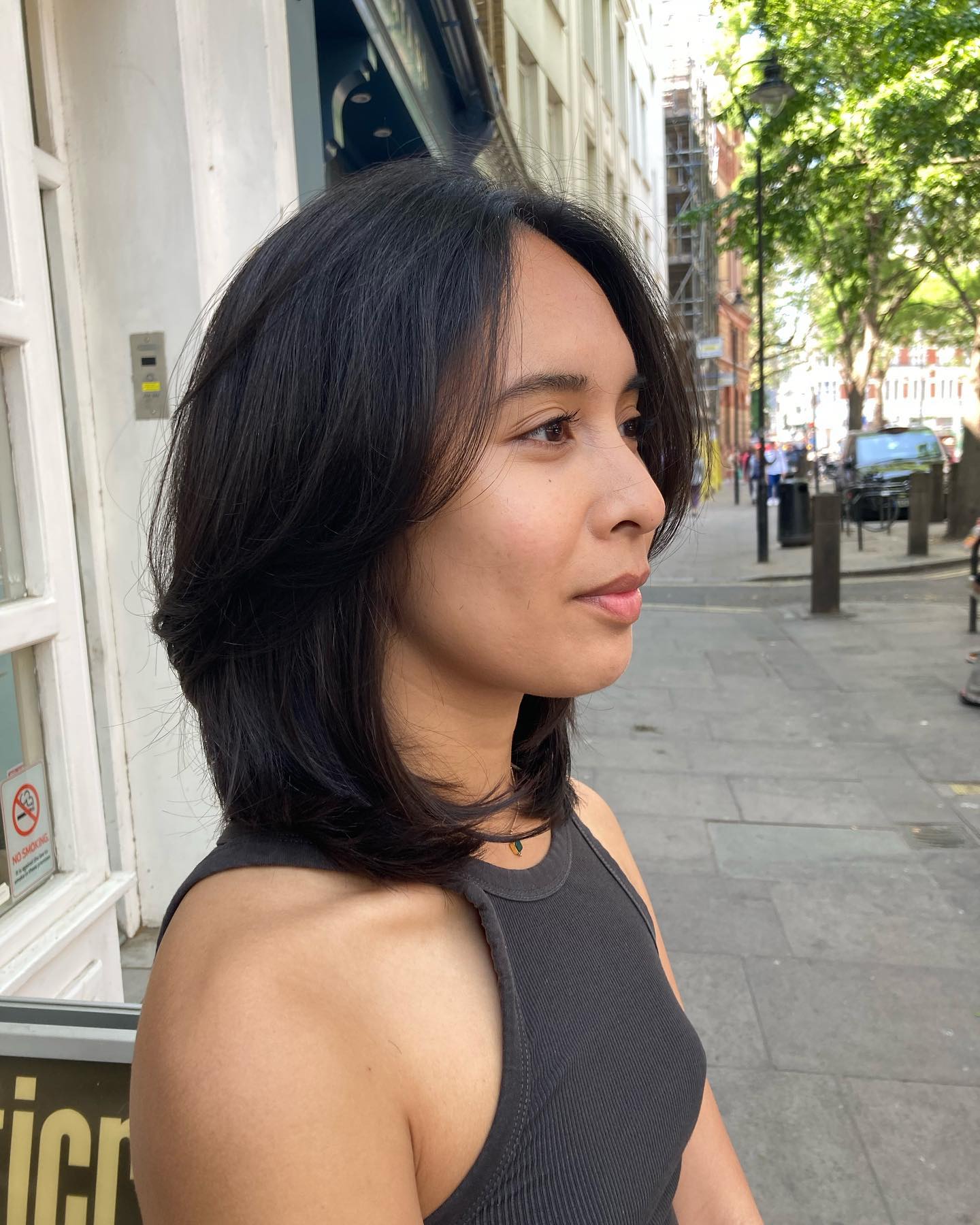 Layered feathered cut with side part