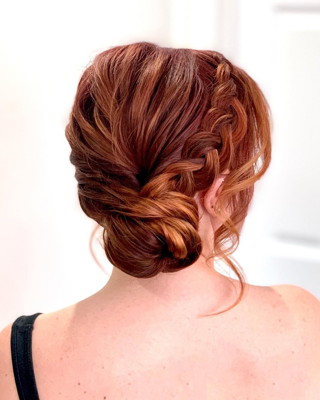 Romantic twisted updo with red highlights