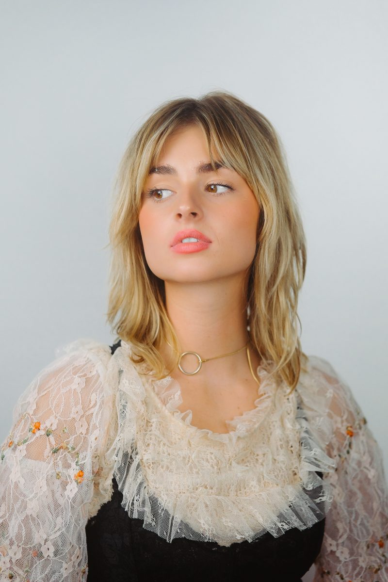 Soft tousled bob with bangs and natural highlights