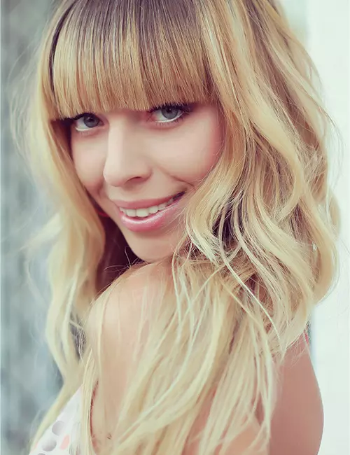 Blonde waves with curtain bangs