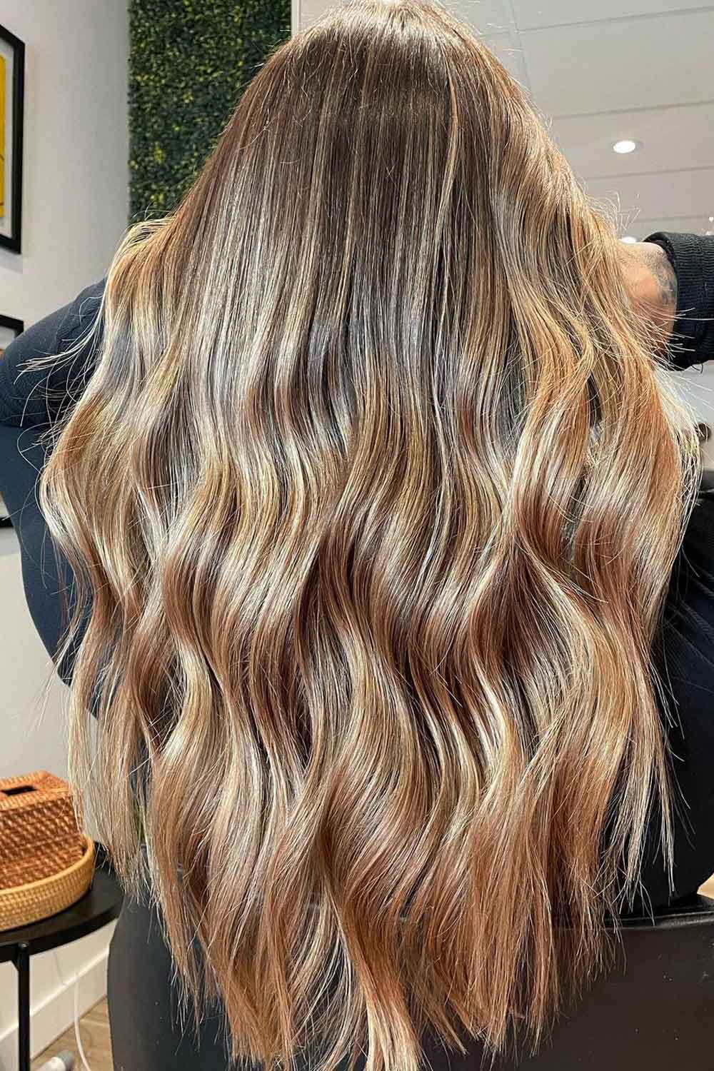 Natural sun-kissed balayage on long wavy hair