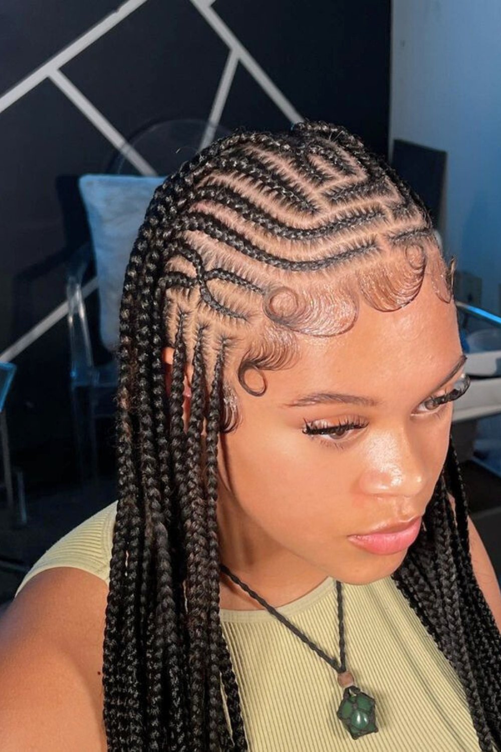 Patterned cornrows with styled baby hairs