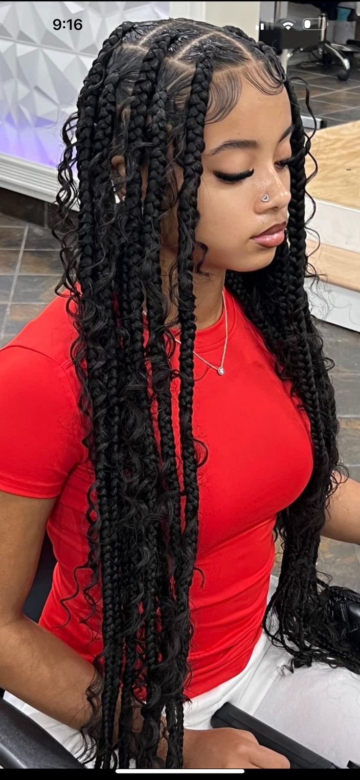 Box braids with curly ends for volume