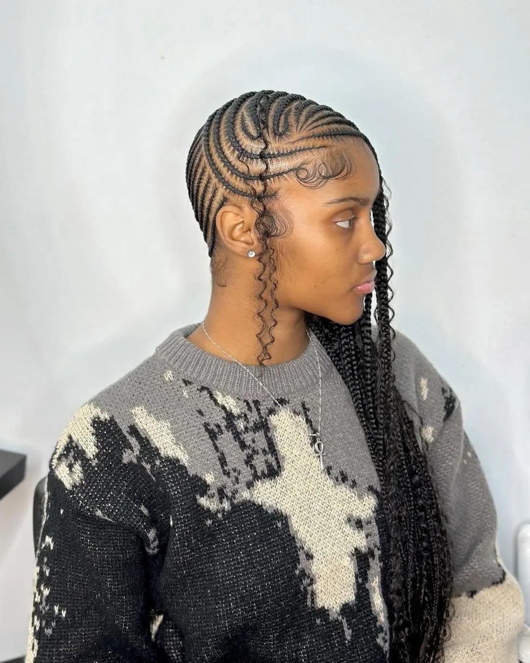 Intricate cornrow design with precision