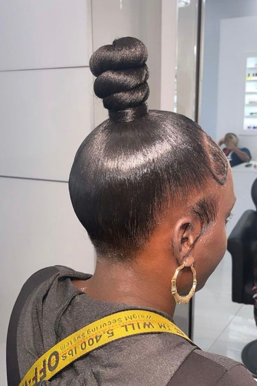 Sculptural top knot with shiny finish