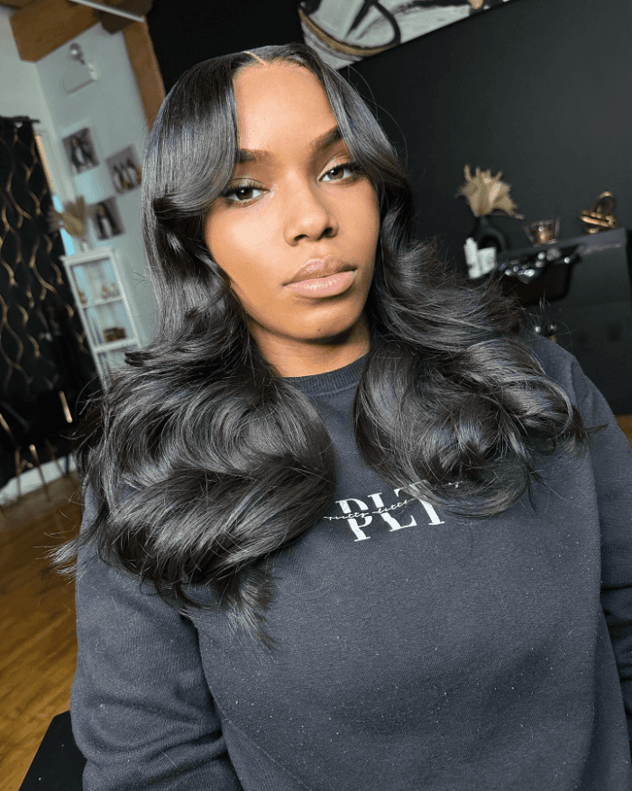 Glossy barrel curls with center part