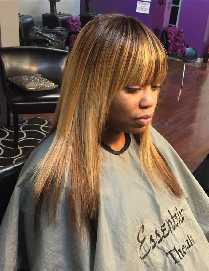 Sleek blonde layers with straight bangs