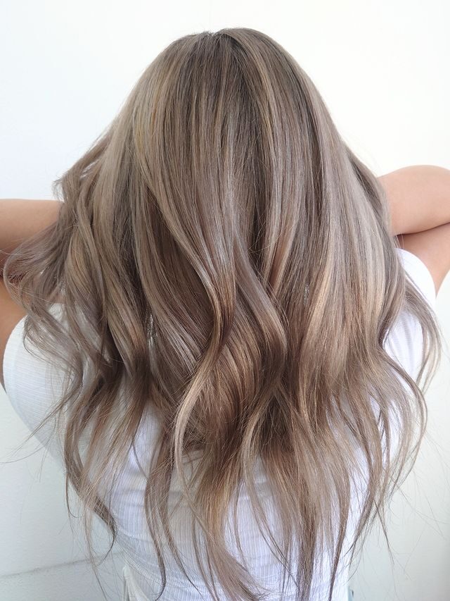 Subtle rose gold balayage with soft waves