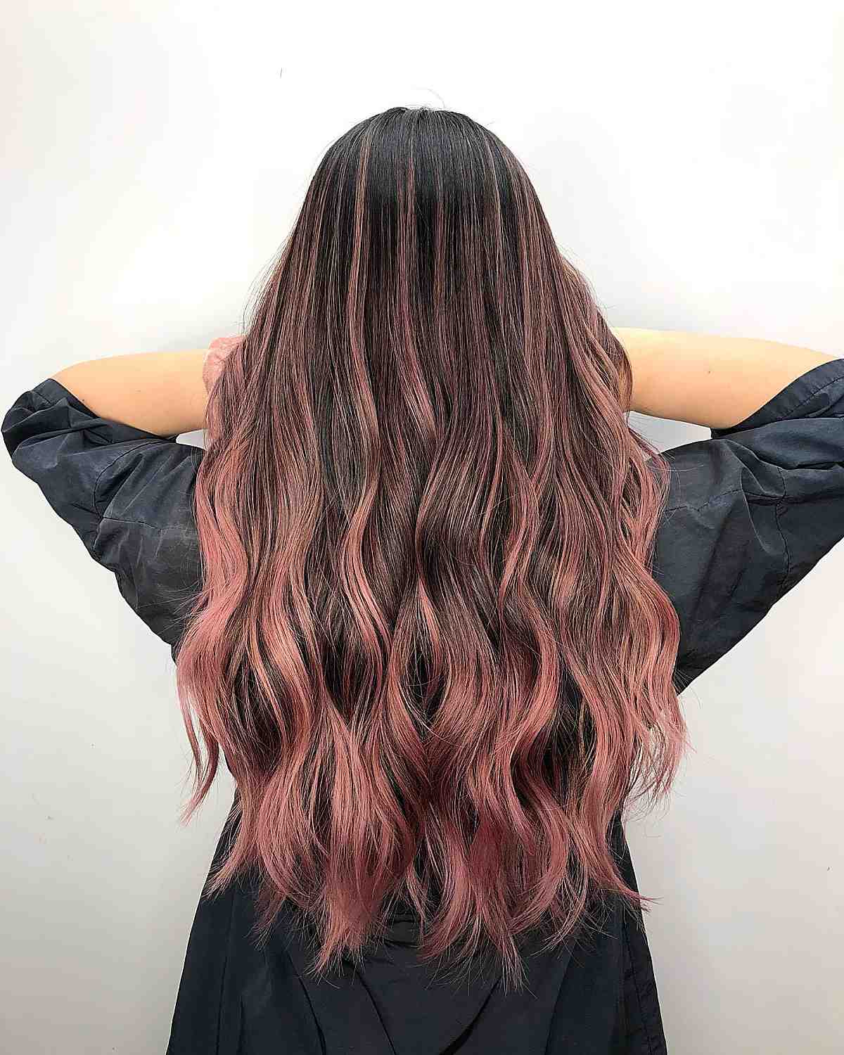 Long rose gold waves with dark roots