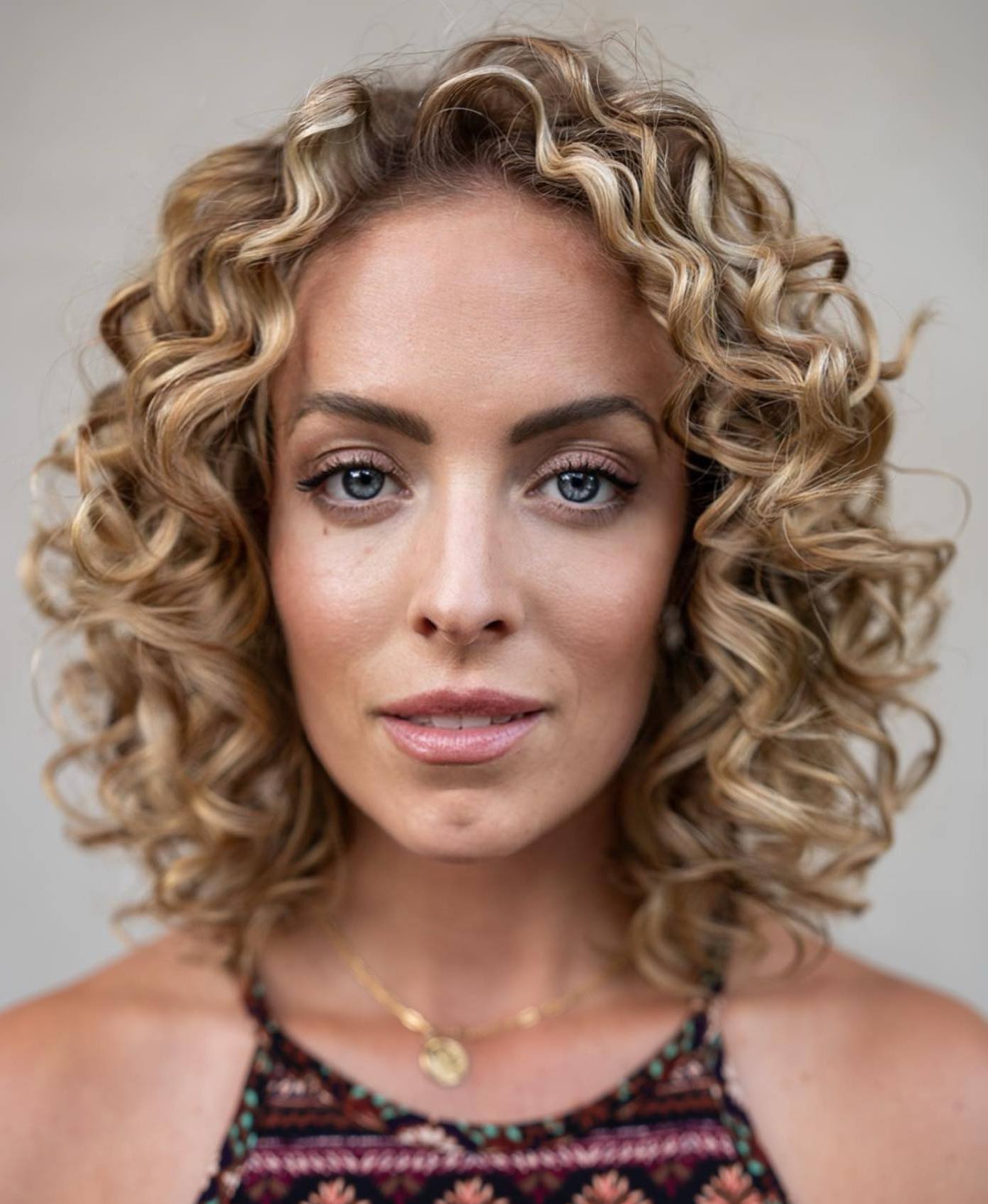 Blonde spiral curls, defined and glamorous
