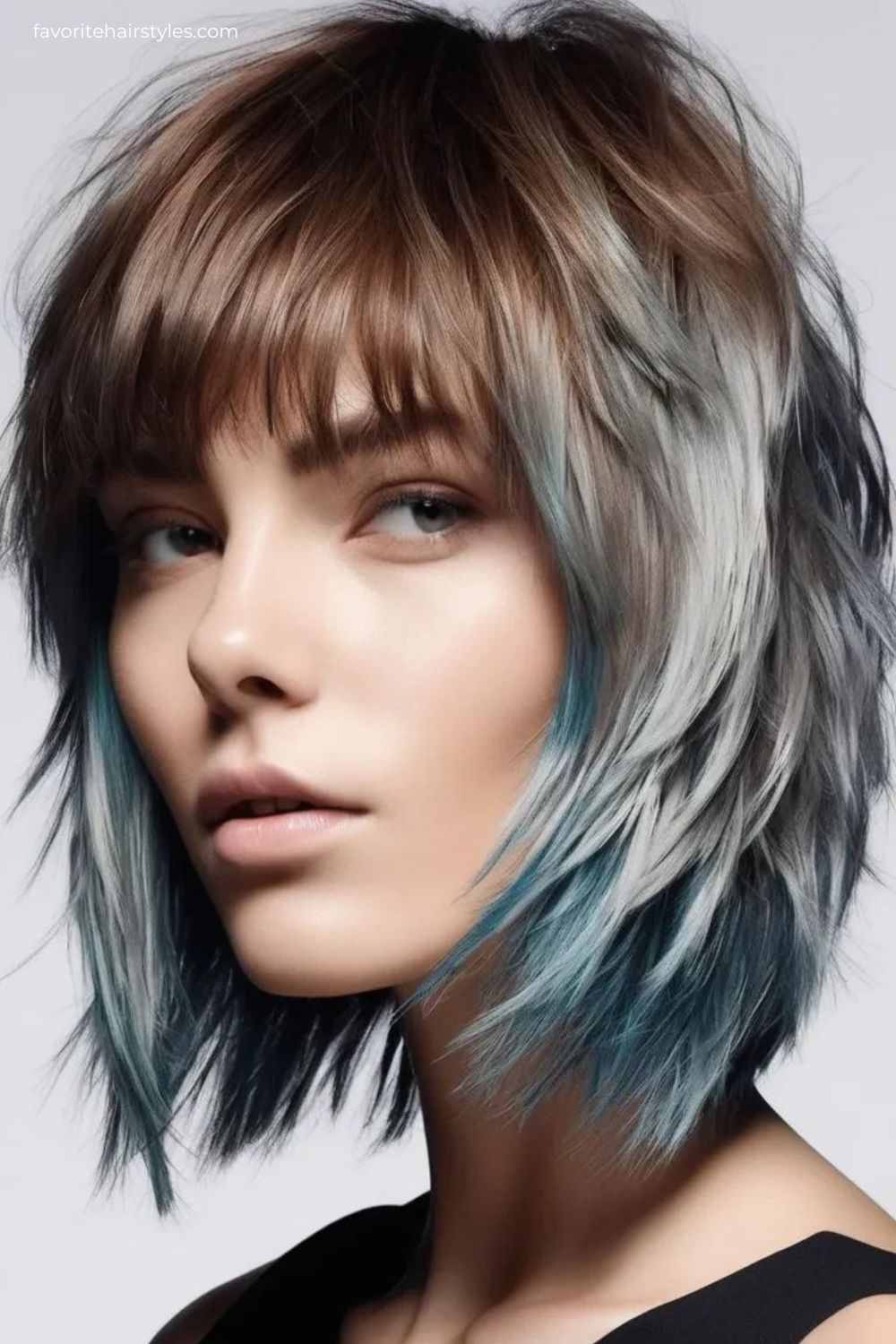 Layered bob with blue highlights and bangs