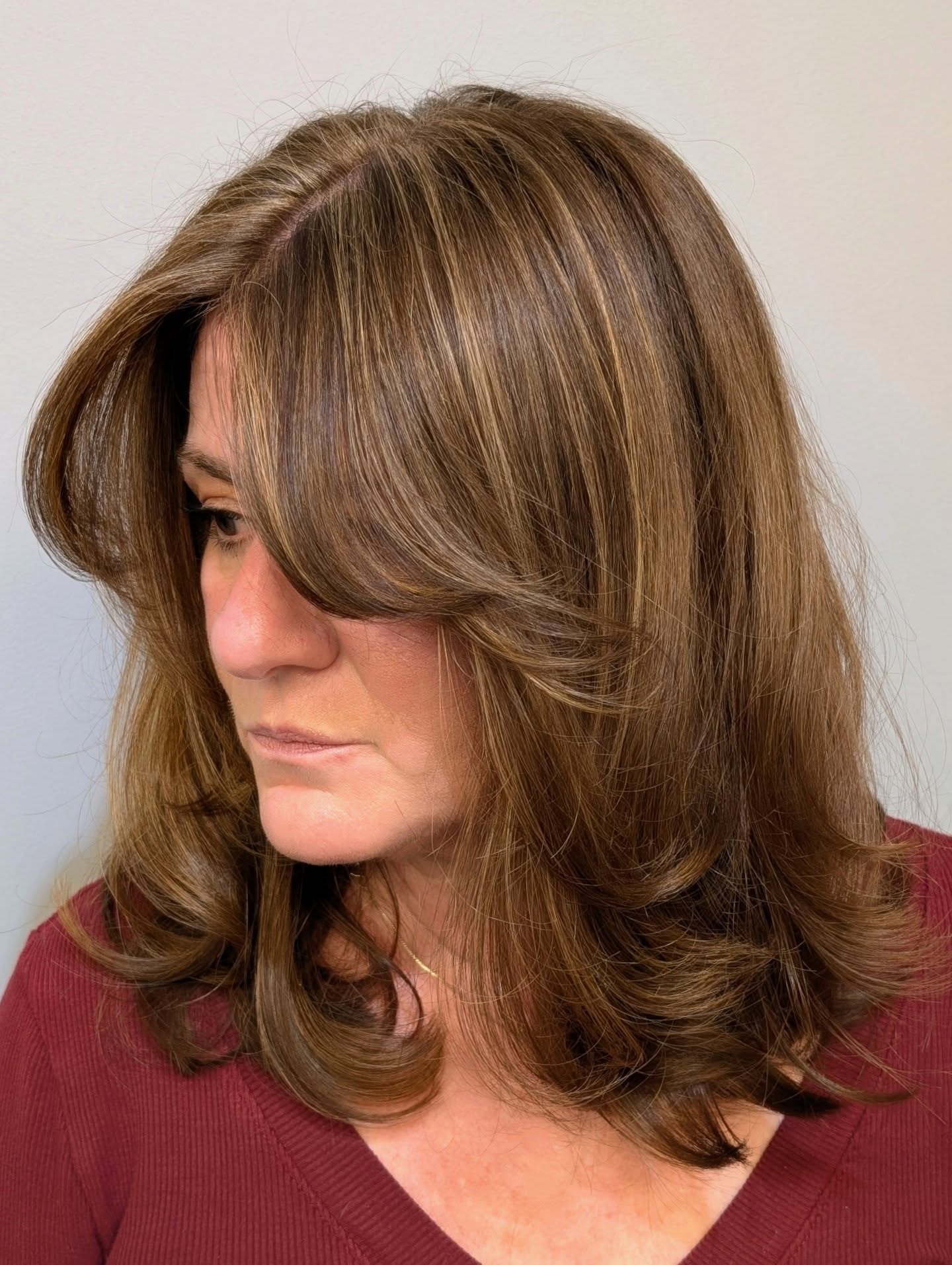 Classic long bob with side-swept bangs and volume