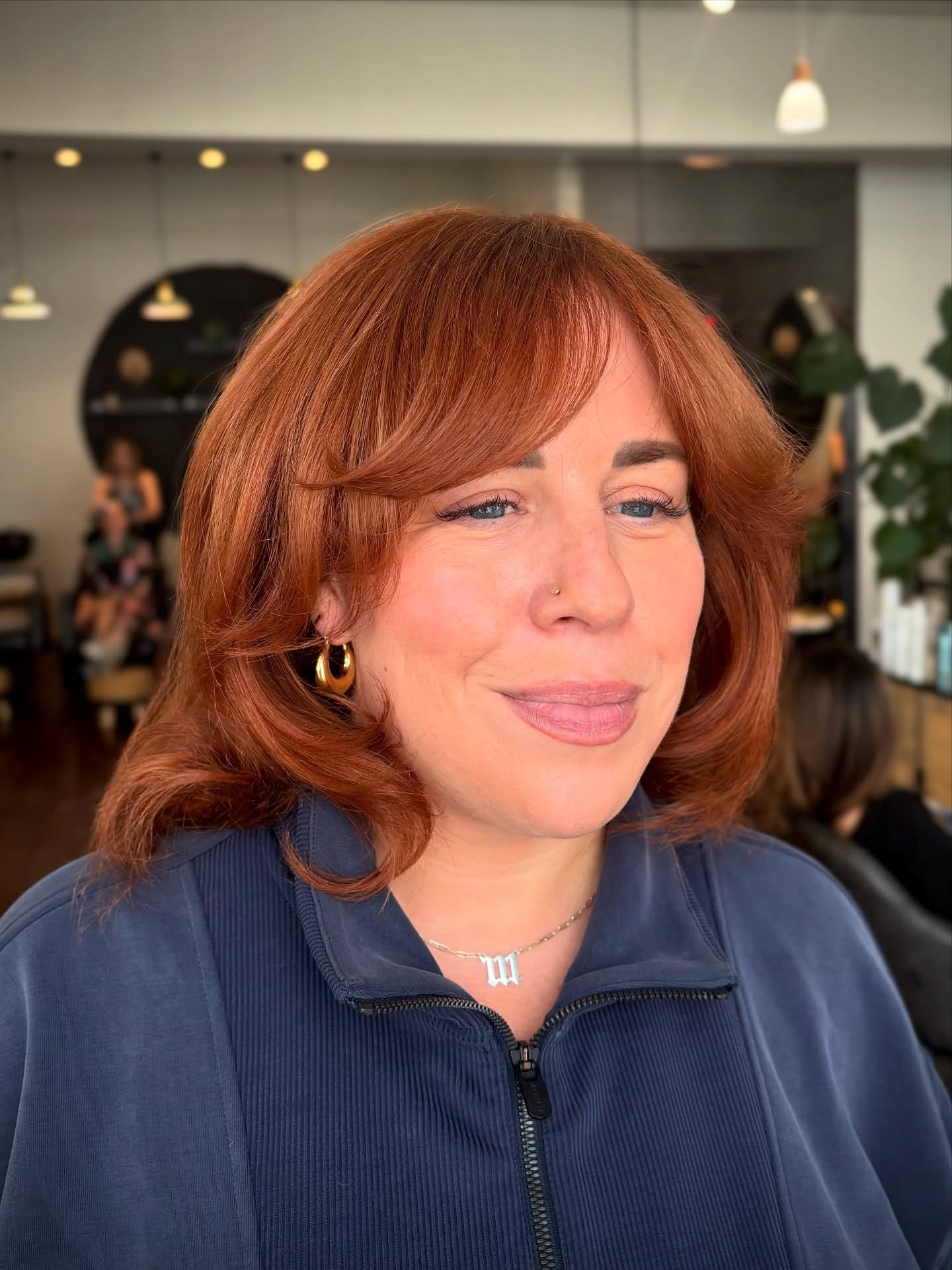 Glamorous red bob with side bangs and volume