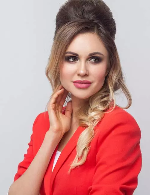 Retro-inspired side part with volume and twist