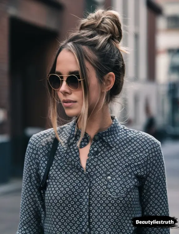 Relaxed top knot with face-framing strands
