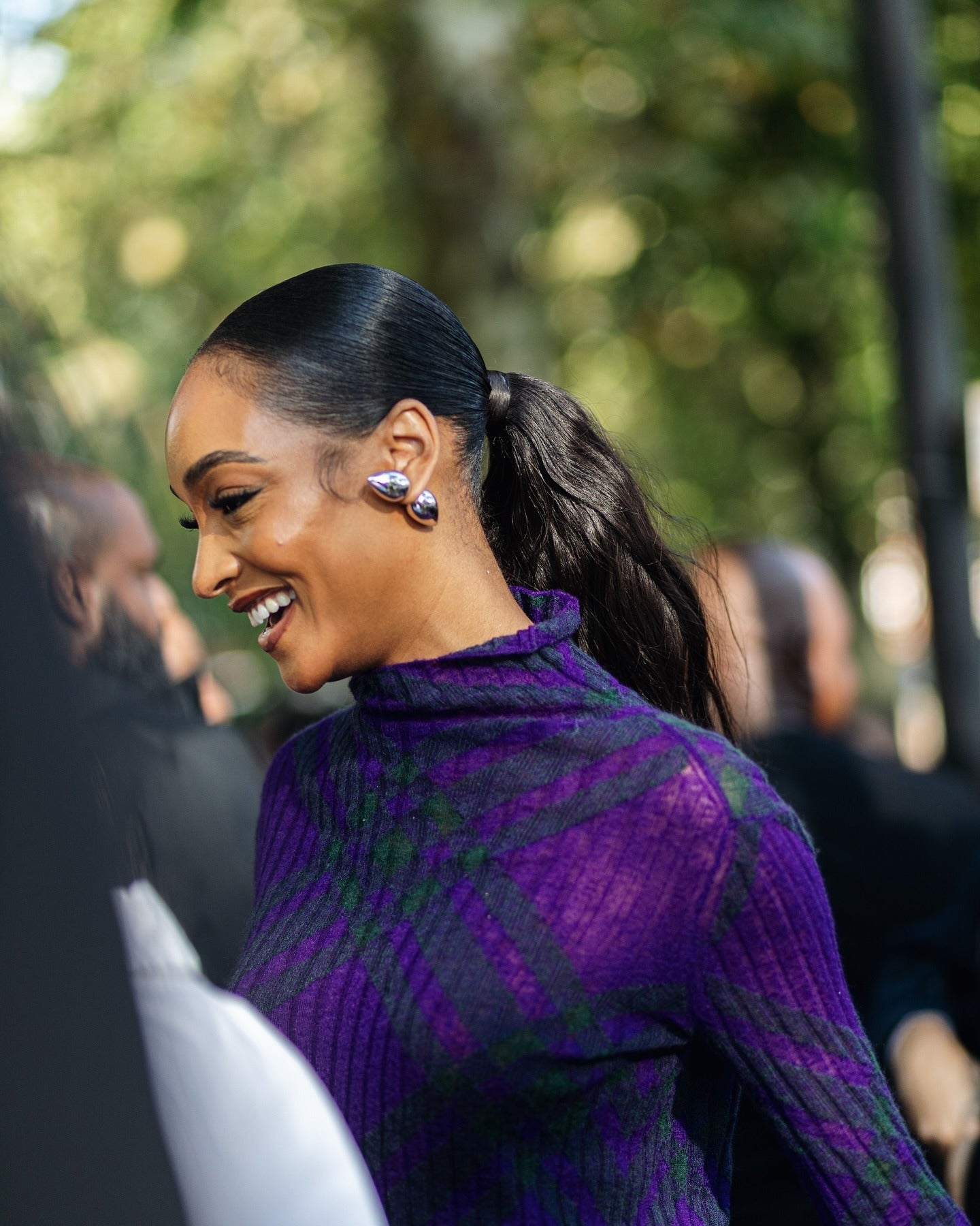 Sleek ponytail with glossy finish