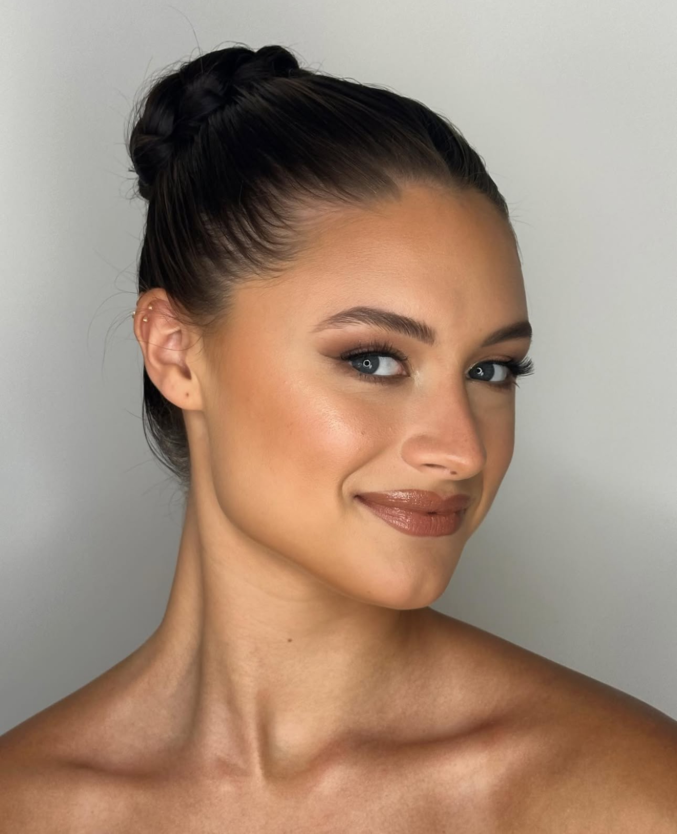 Elegant twisted bun with sleek sides