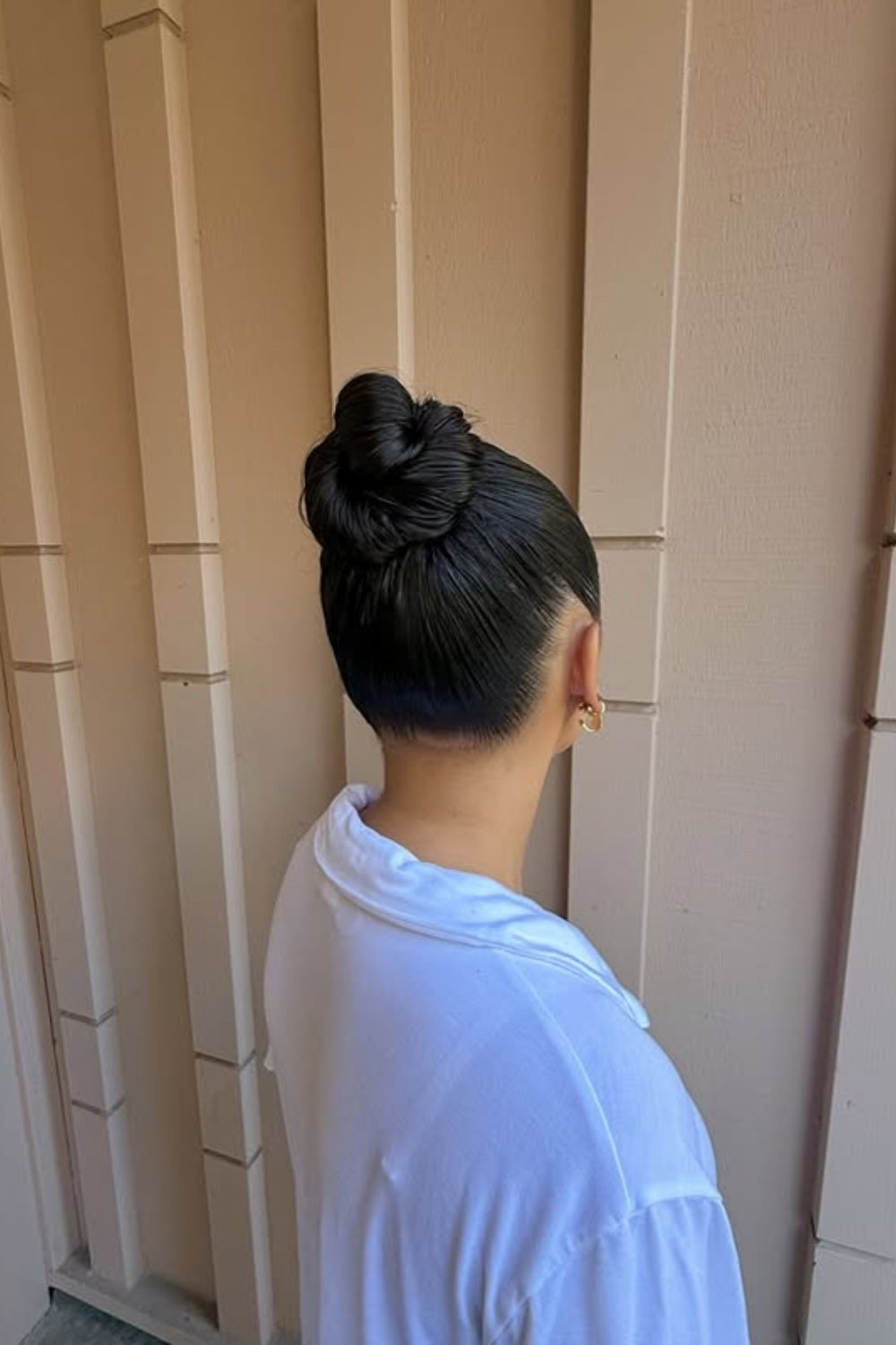 Elegant high bun with sleek texture