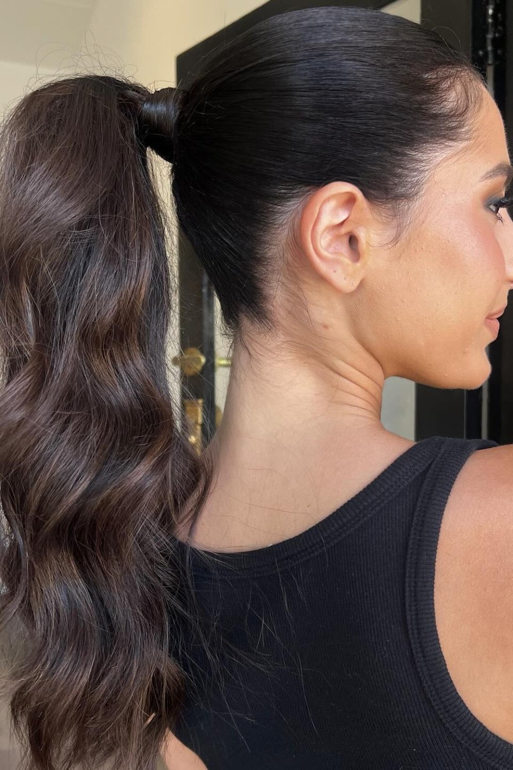 High ponytail with wavy texture