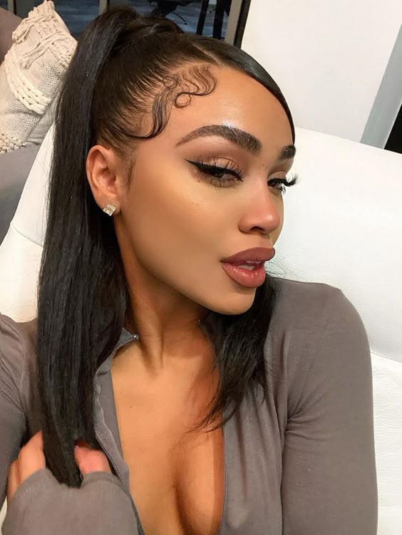 Sleek high ponytail with defined baby hair