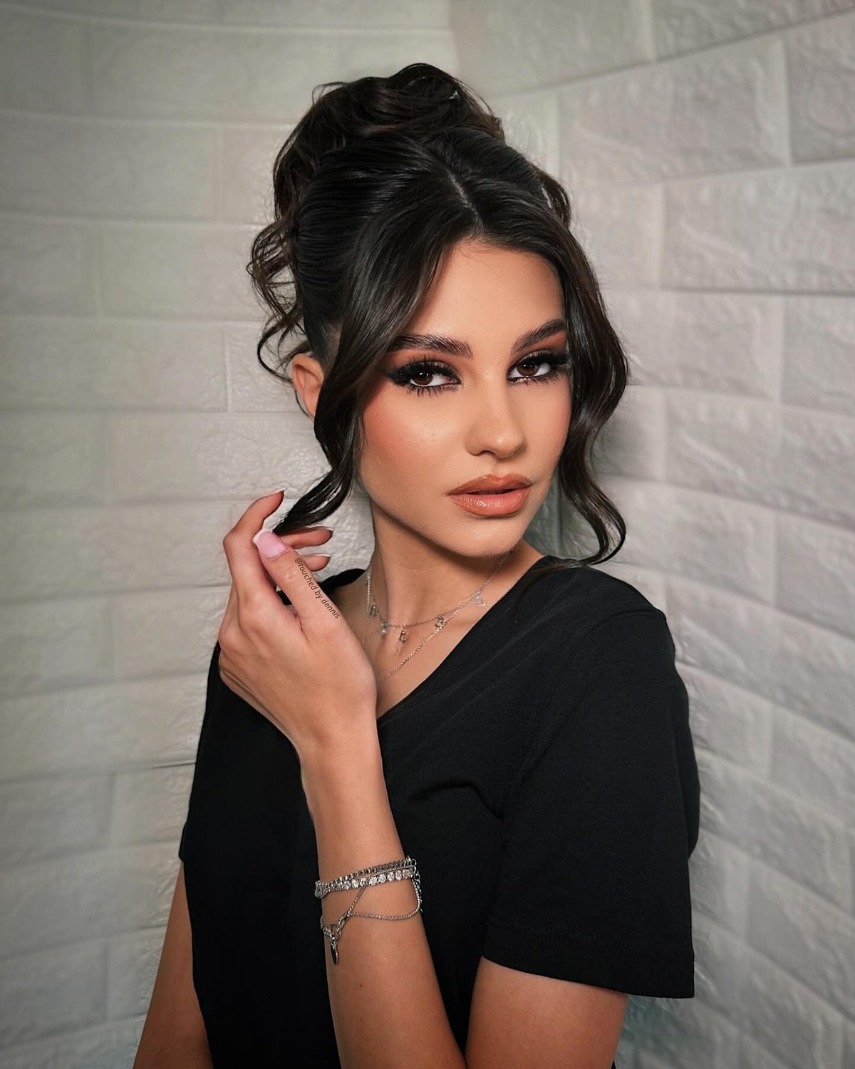 High bun with soft texture and waves