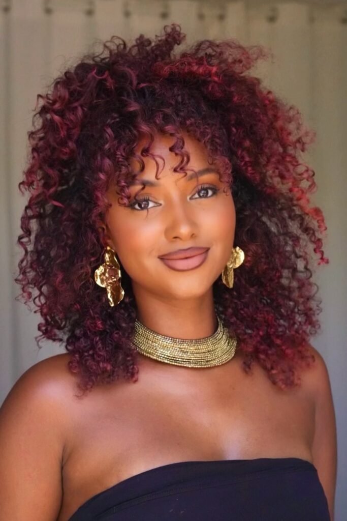 Vibrant red curly hairstyle, bold and lively, dynamic spring look.