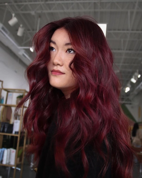 Deep ruby red waves, luxurious spring hair color, bold and rich tones