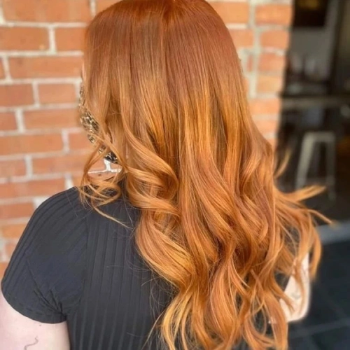 Fiery copper waves, luxurious vibrant spring hair color, bold statement